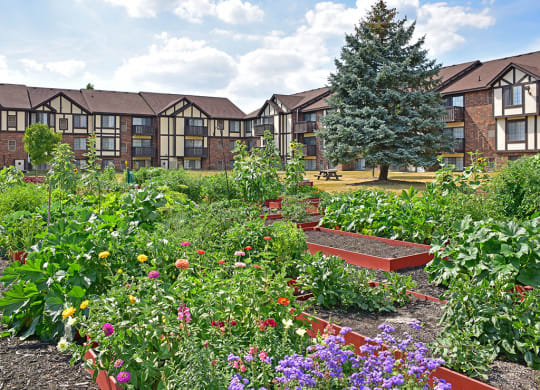 Courtyard Garden With Flowers at Charter Oaks Apartments, Davison, Michigan