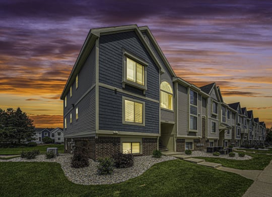 sunset view of apartment building at The Crossings Apartments, Michigan, 49508