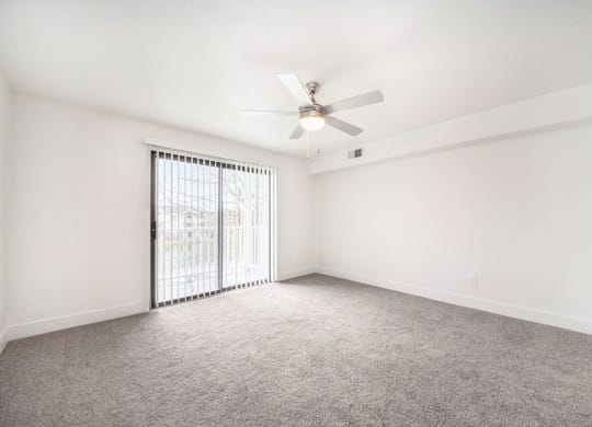 Renovated Living Room with Ceiling Fan at The Crossings Apartments, Grand Rapids, Michigan