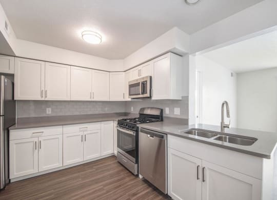 Renovated Kitchen with Shaker Cabinetry at The Crossings Apartments, Grand Rapids, Michigan