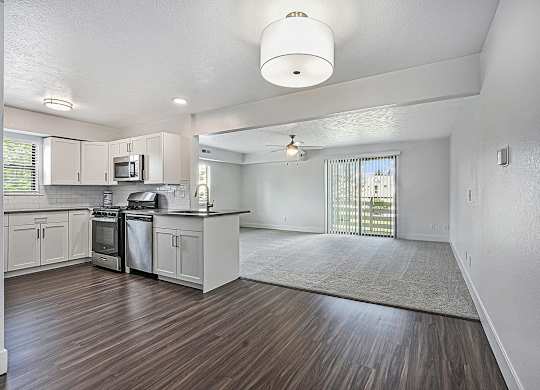 end style kitchen and living room at The Crossings Apartments, Michigan, 49508