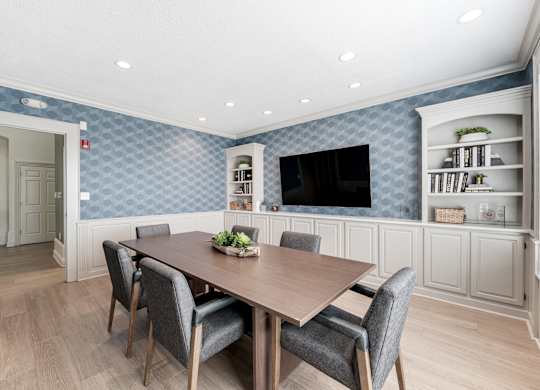a dining room with a table and chairs at Latitudes Apartments, Indianapolis