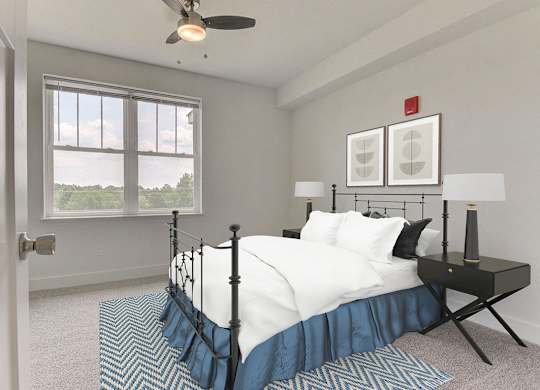 A bedroom with a bed, nightstand, ceiling fan and a window at Dodson Pointe Apartment Homes, Rogers
