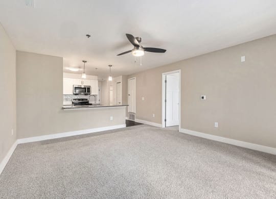 Two bedroom living room leading to modern kitchen at Eagle Ridge Apartment Homes, Traverse City, 49685