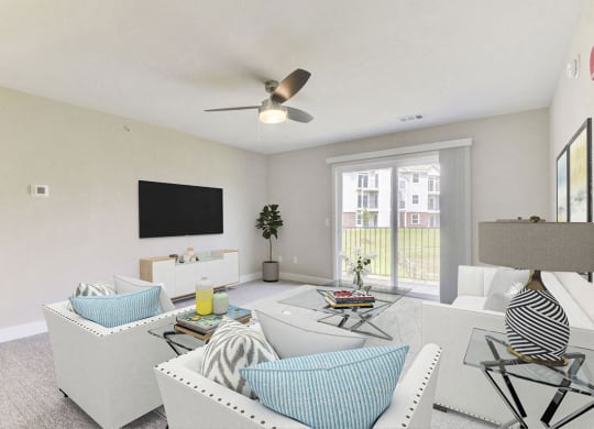Two bedroom living room with ceiling fan at Eagle Ridge Apartment Homes, Traverse City