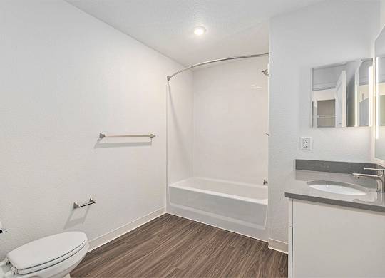 Primary bathroom with hard surface flooring at Eagle Ridge Apartment Homes,  Michigan