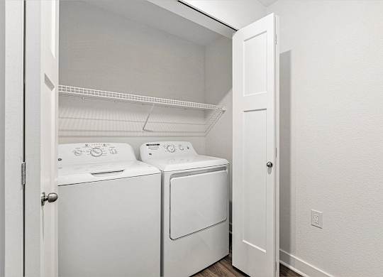 Laundry with full size washer and dryer at Eagle Ridge Apartment Homes, Traverse City