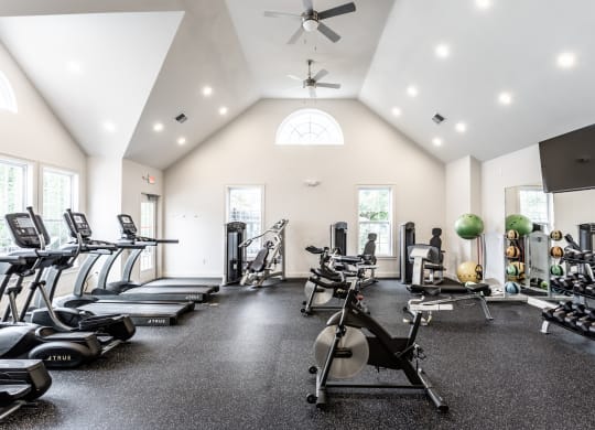 Fitness center with equipment at Alexandria of Carmel Apartments, Indiana