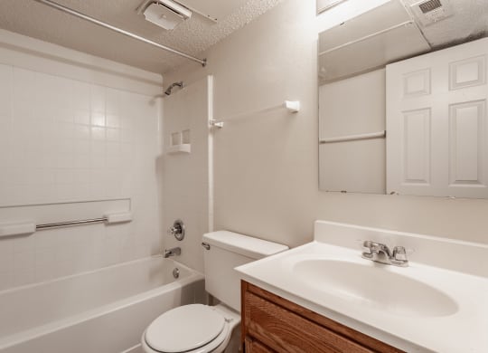 a bathroom with a sink toilet and bathtub at Bavarian Village Apartments, Indianapolis, IN