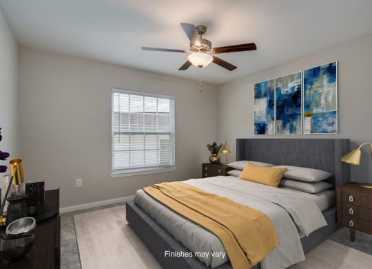 a bedroom with a bed and a ceiling fan  at Killian Lakes Apartments and Townhomes, South Carolina, 29203