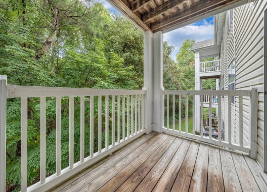 a balcony with a woodland view at The Vinings Apartments, Richmond, Virginia