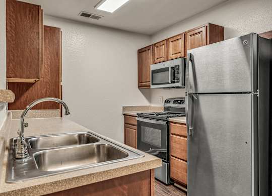 Kitchen with cabinets at Enclave Apartments, Midlothian, Virginia