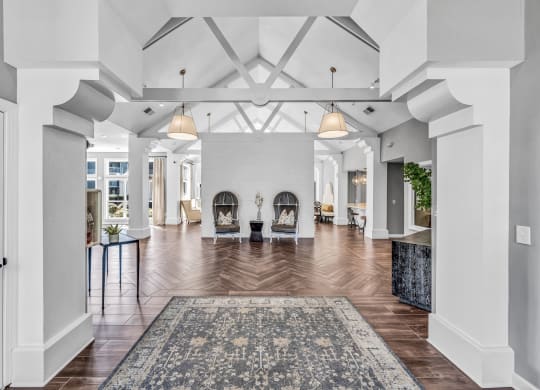 a large living room with a fireplace and a rug at Trophy Club at Bellgrade, Midlothian, VA, 23113