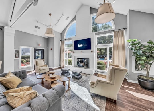 a living room with a couch and chairs and a fireplace at Trophy Club at Bellgrade, Midlothian, VA, 23113