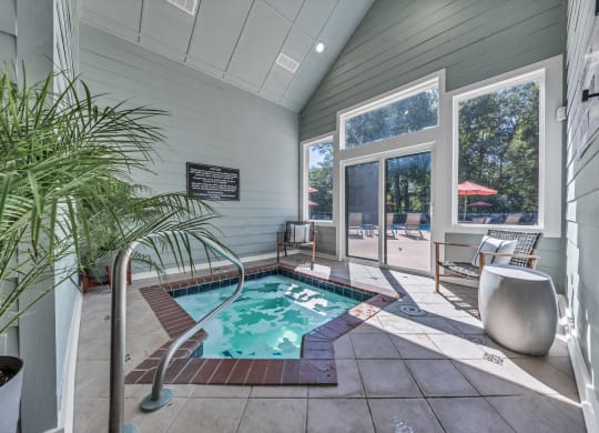 a small pool in the corner of a house with a sliding glass door at Trophy Club at Bellgrade, Midlothian, VA, 23113