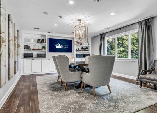 a dining room with a table and chairs and a large window at Trophy Club at Bellgrade, Midlothian, VA, 23113