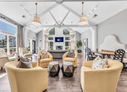 a living room with couches and chairs and a fireplace at Trophy Club at Bellgrade, Midlothian, VA, 23113