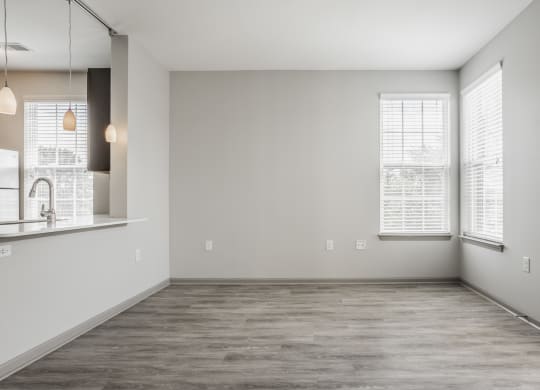 an empty living room with a sink and a window at The Avenue at Polaris Apartments, Columbus, OH