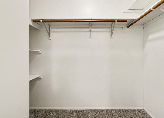 A walk-in  closet with shelving at Emerald Park Apartments, Kalamazoo, Michigan