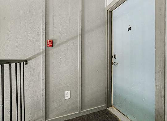 A stairway to an apartment entry door at Emerald Park Apartments in Kalamazoo, MI