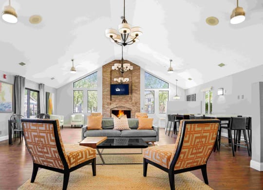 a living room with a couch and chairs and a fireplace at Bay Pointe Apartments, Lafayette, IN, 47909