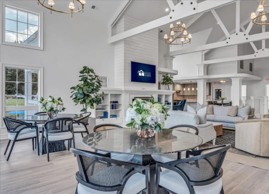 a large living room with a table and chairs at The Vinings Apartments in Richmond, VA