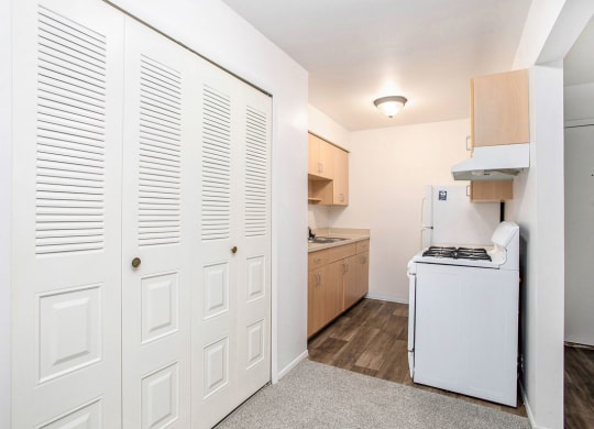 a kitchen with a large closet at Fairlane Apartments in Springfield, MI