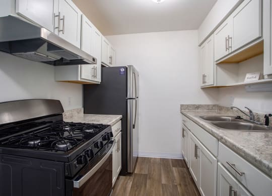 a kitchen with stainless steel appliances at Fairlane Apartments in Springfield, MI