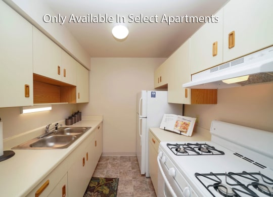 White Appliances and Almond Cabinets at Fairlane Apartments, Michigan