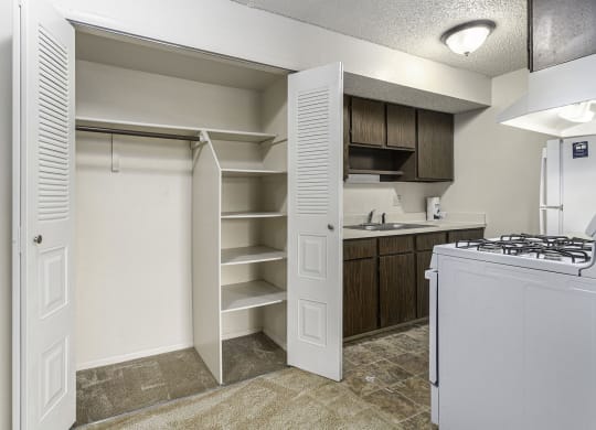 a kitchen with a large closet with shelving at Old Farm Apartments, Elkhart, Indiana