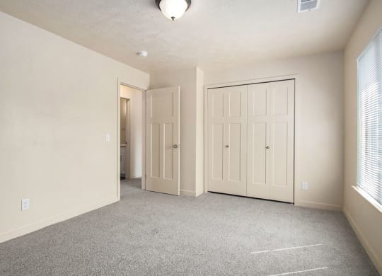 upgraded bedroom has plenty of closet space at Old Farm Apartments, Elkhart, Indiana