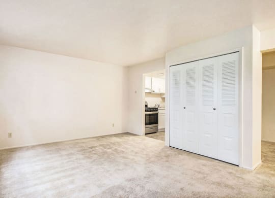 studio living room with plush carpeting at Old Farm Apartments, Elkhart, Indiana