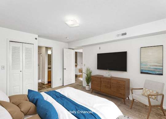 a bedroom with an attached bath at Fieldstream Apartment Homes, Iowa