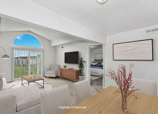 a living room with a cathedral ceiling at Fieldstream Apartment Homes, Iowa