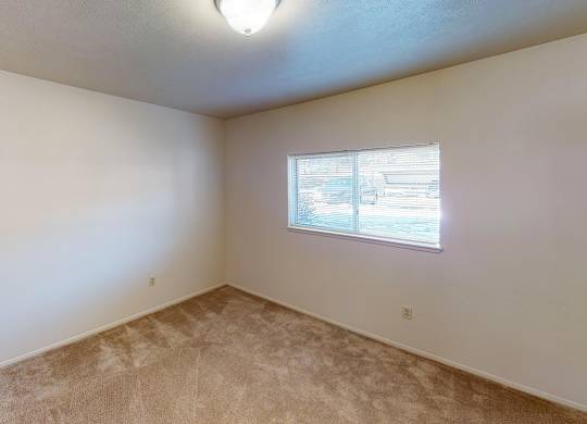 A spacious bedroom with a window at Foxwood and The Hermitage, Portage, MI