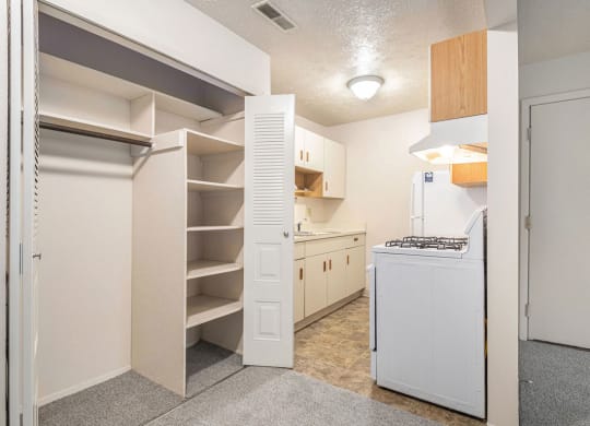 Kitchen and dining area with a closet at Glen Oaks Apartments, Muskegon