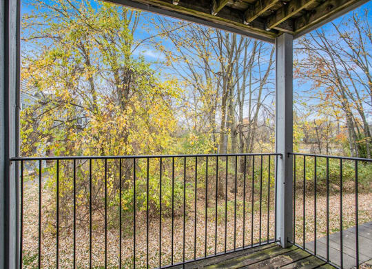a balcony with a view of trees at Glenn Valley Apartments in Battle Creek, MI