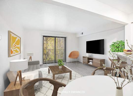 A modern living room with a white sofa, wooden chairs, a TV, and a dining table at Glenn Valley Apartments in Battle Creek, MI