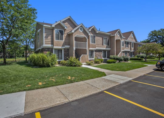 Landscaped grounds with walkways at Hampton Lakes Apartments, Walker, MI, 49534