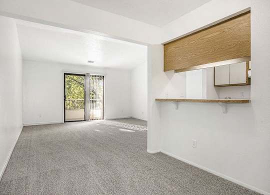 dining and living rooms with carpet at Hampton Lakes Apartments, Michigan, 49534