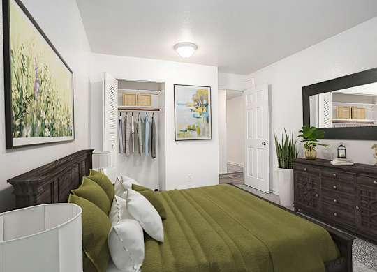 A bedroom with a closet, bed and a wooden dresser at Hampton Lakes Apartments, Michigan, 49534