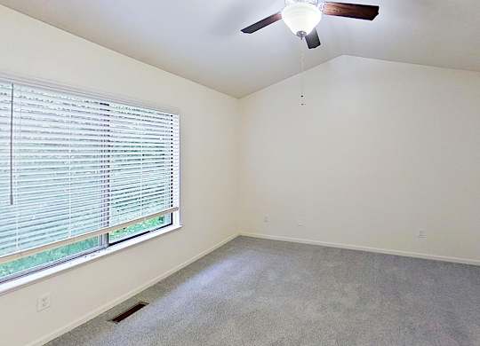 Master bedroom with a cathedral ceiling and ceiling Fan at Foxwood and The Hermitage, Portage, MI