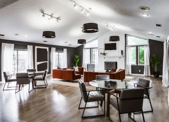 a dining room and living room with a table and chairs