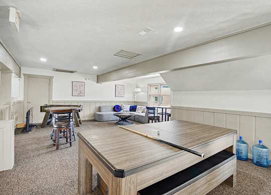 A loft area with a pool table and a couch at Indian Lakes Apartments, Mishawaka, Indiana