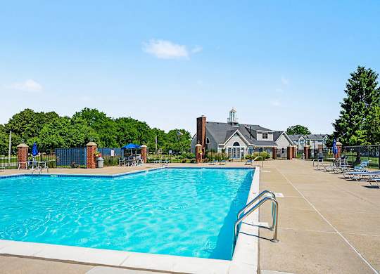 A large swimming pool with a building in the background at Indian Lakes Apartments, Mishawaka, Indiana