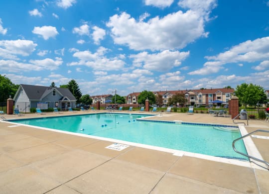 Outdoor Swimming Pool with Lounge Chairs at Indian Lakes Apartments, Mishawaka, IN, 46545