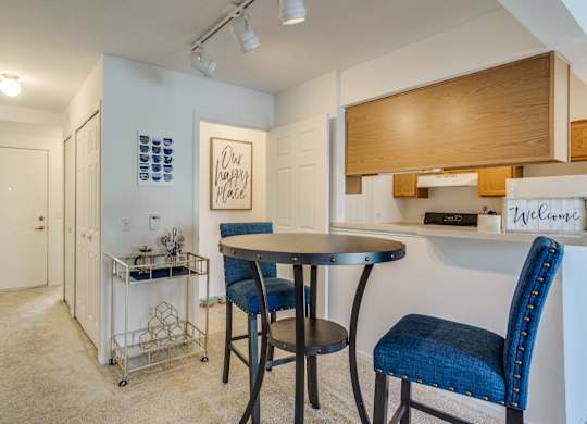 A dining area with a table and chairs  at Northport Apartments, Macomb, MI, 48044