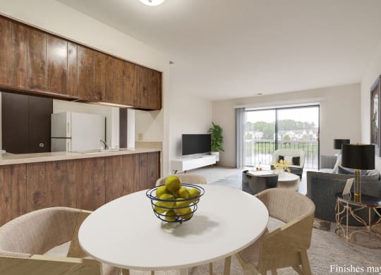 a kitchen and living room with a white table and chairs and a bowl of fruit on the at The Landings Apartments, Westland, MI, 48185