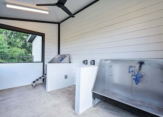 A room with a white wall and a ceiling fan at Ironwood Flats Apartments, Florida