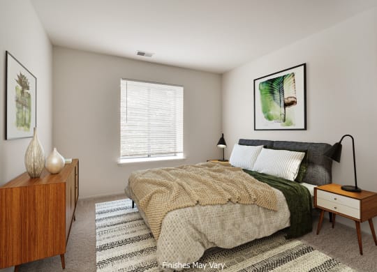 a bedroom with a large bed and a dresser with a lamp on it at The Landings Apartments, Westland, 48185